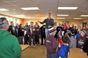 Matt Goihl, chair of the “Leaf Raking for Seniors Citizens” event, gives students, parents, coaches, and Optimist Club Members final instructions before sending the team out for a morning of raking. The folks that worked enjoyed donuts and juice at the Recreation Center.