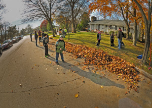 With the sun low in the morning sky, it cast a long shadow of Gavin Pawlowski, age 8, a third grader at Riverside School. Gavin with other members of Cub Pack 109 cleaned a yard in the 8700 block of Shepherd Drive.